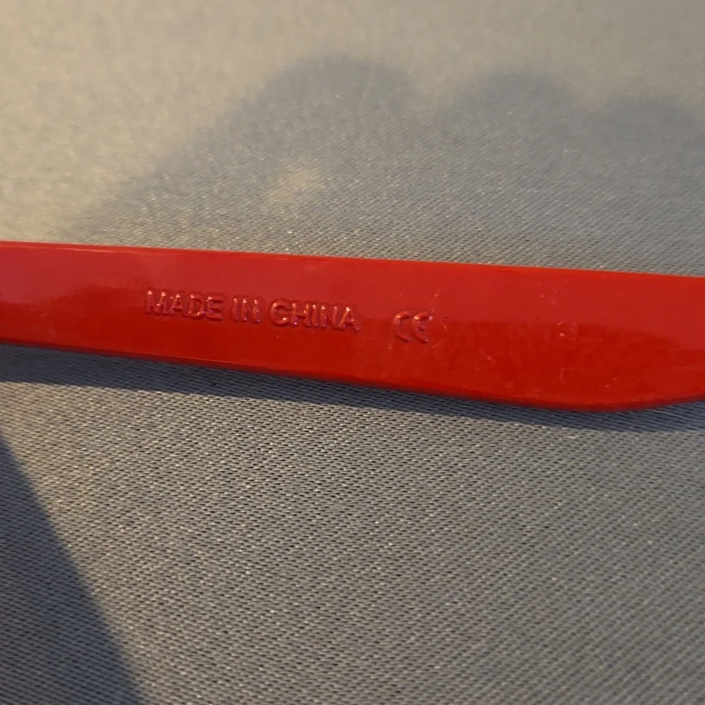 Red sunglasses unisex with bottle opener built in tailgate